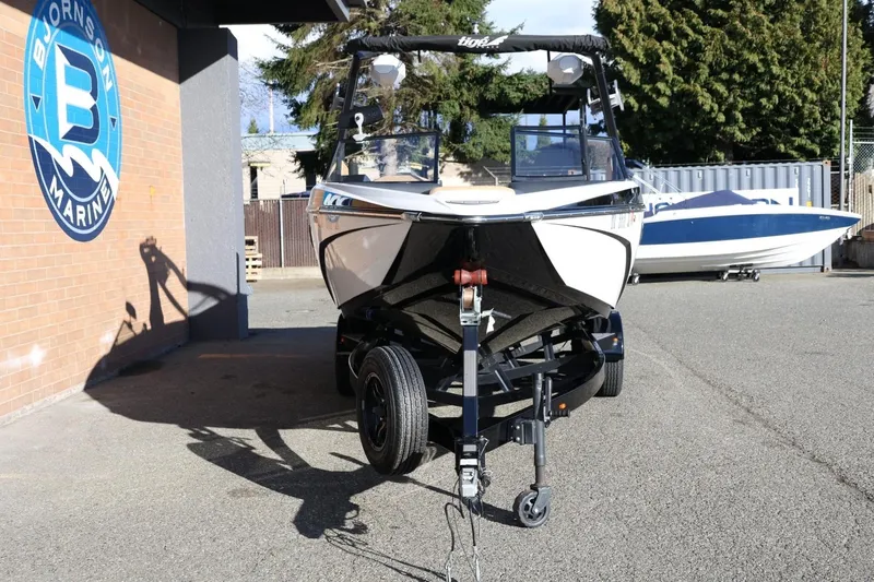 Slide: The Image of 2023 Tigé Z3 boat on trailer at Bjornson Marine dealership. - 12