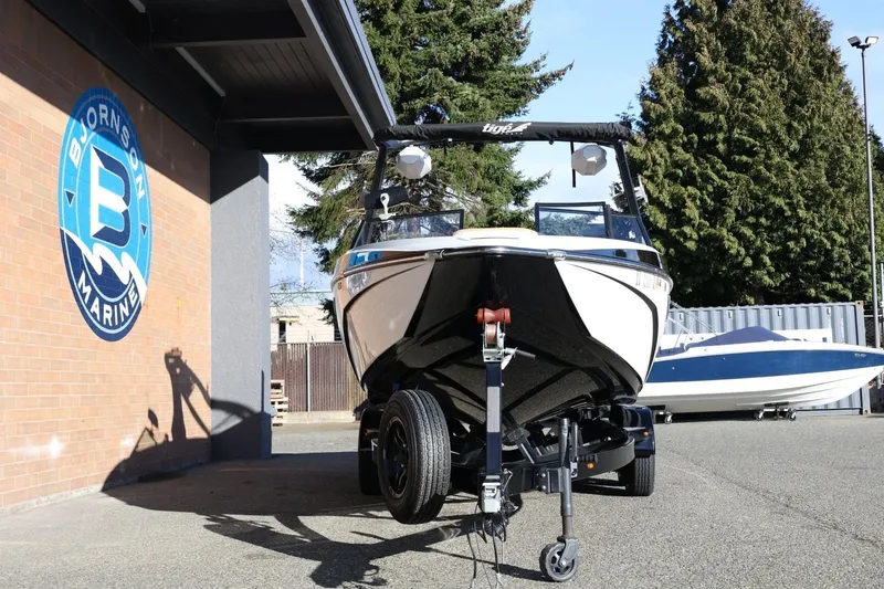 Slide: The Image of 2023 Tigé Z3 boat on trailer at Bjornson Marine dealership. - 13