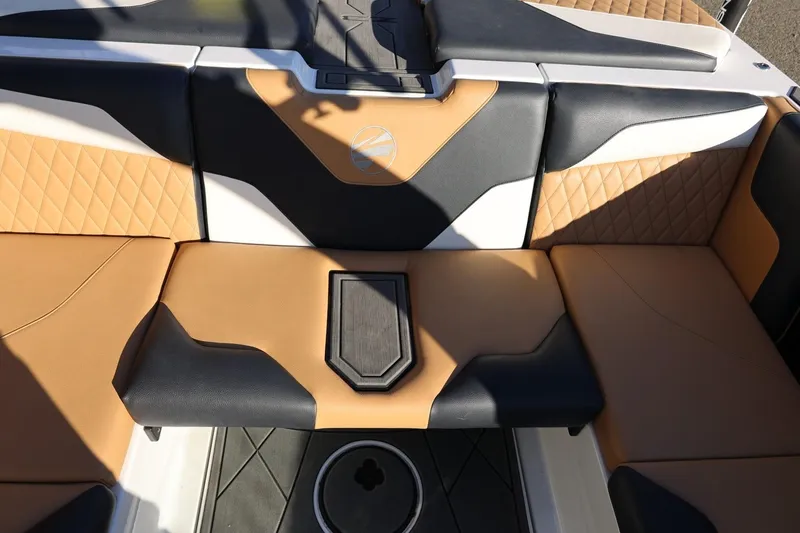 Slide: The Image of 2023 Tigé Z3 boat interior with tan and black seating, diamond stitching. - 30