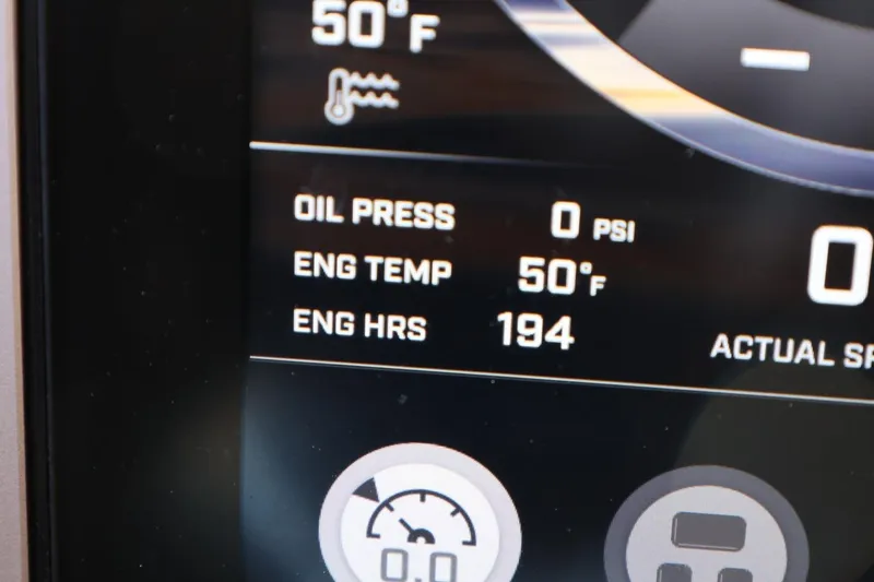 Slide: The Image of Dashboard display of a 2023 Tigé Z3 showing engine temperature and hours. - 33