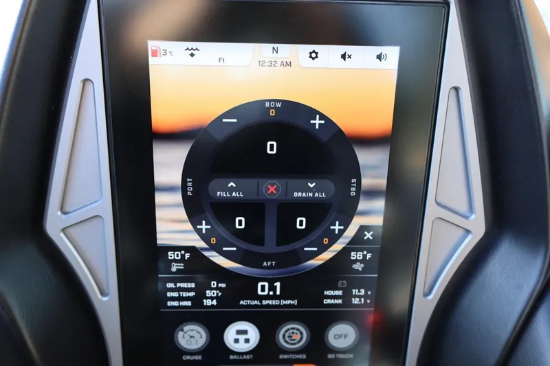 Slide: The Image of 2023 Tigé Z3 boat touchscreen display showing ballast and engine controls. - 38