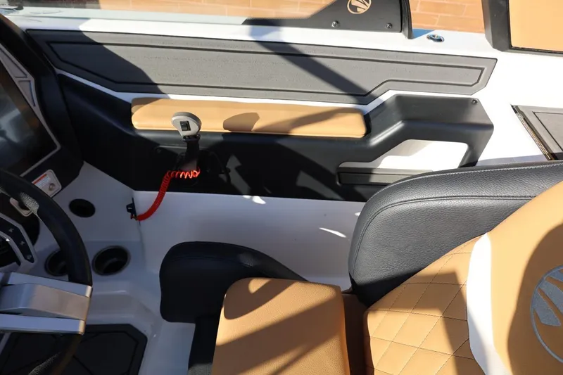 Slide: The Image of Interior of 2023 Tigé Z3 boat with tan and black seating, modern dashboard. - 41