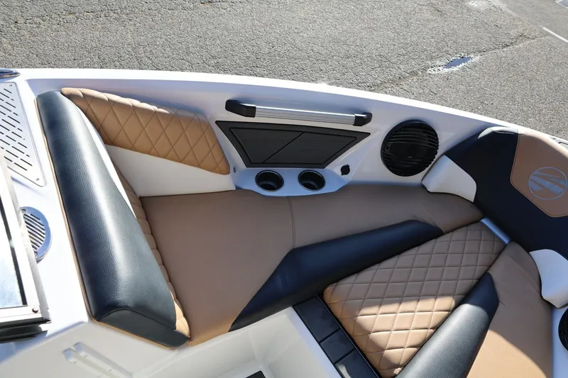 Slide: The Image of 2023 Tigé Z3 boat interior with tan and black quilted seating. - 43