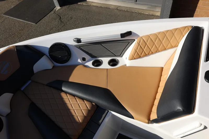 Slide: The Image of 2023 Tigé Z3 boat interior with tan and black quilted seating. - 44