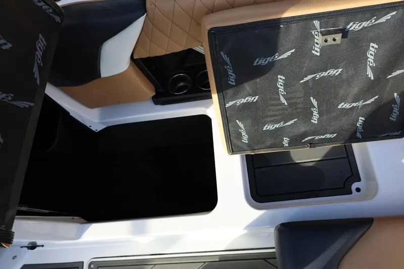 Slide: The Image of 2023 Tigé Z3 boat interior with tan and black seating, featuring Tigé branding. - 50
