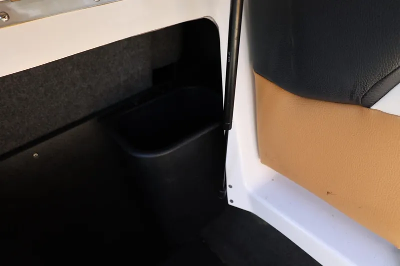 Slide: The Image of Interior detail of 2023 Tigé Z3 boat, featuring storage compartment and upholstery. - 51
