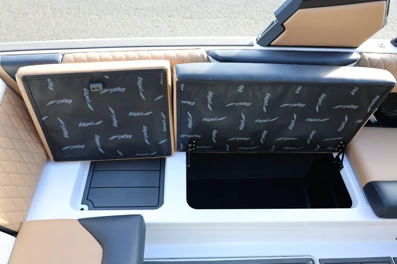 Slide: The Image of 2023 Tigé Z3 boat interior storage compartments with cushioned seating and stylish design. - 55