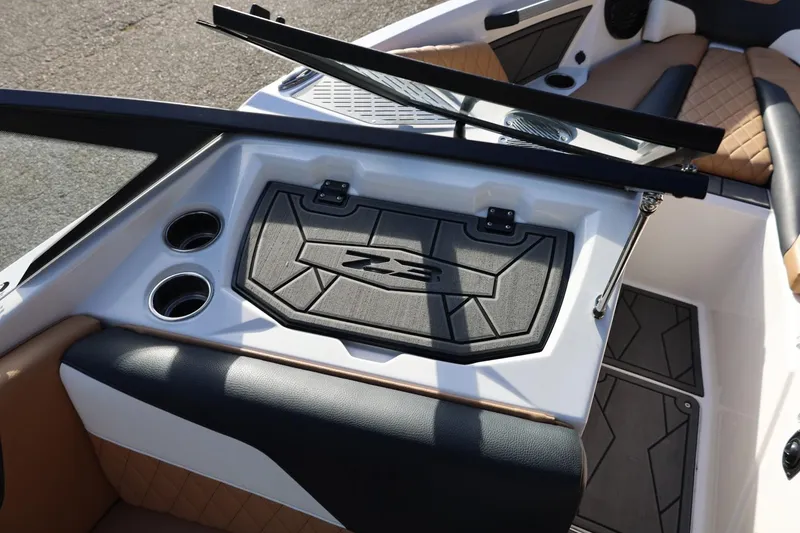 Slide: The Image of 2023 Tigé Z3 boat interior with cup holders and stylish seating. - 58