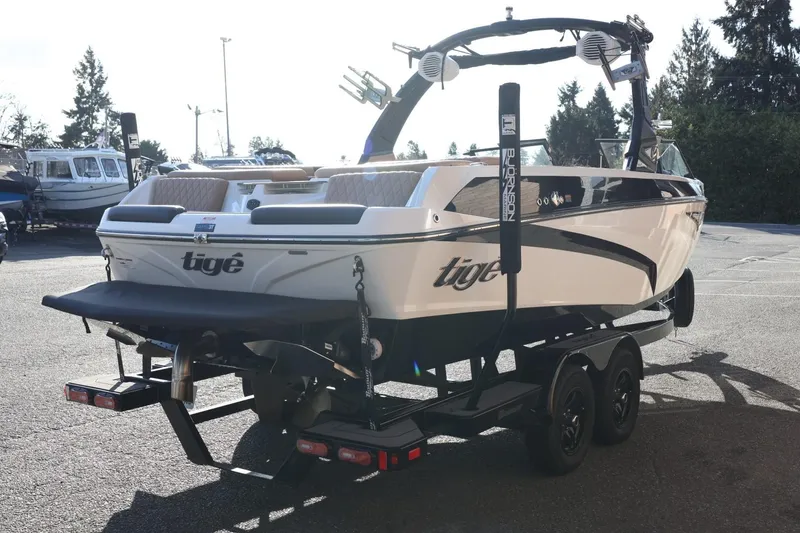 Slide: The Image of 2023 Tigé Z3 boat on trailer, parked outdoors, showcasing sleek design and modern features. - 7