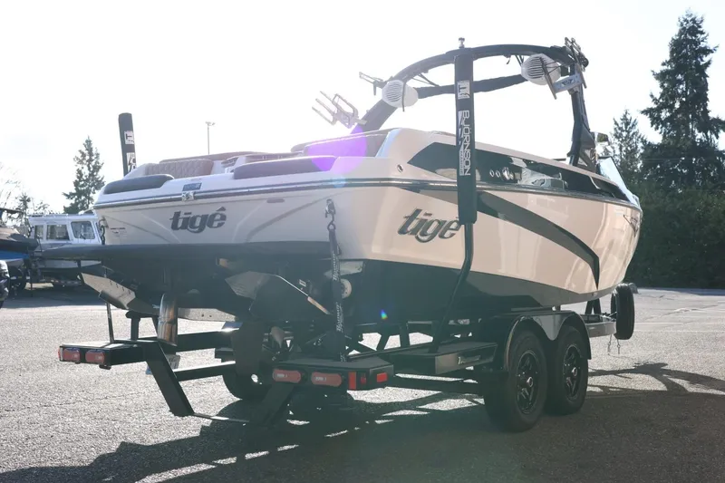 Slide: The Image of 2023 Tigé Z3 boat on trailer, rear view, parked outdoors. - 8