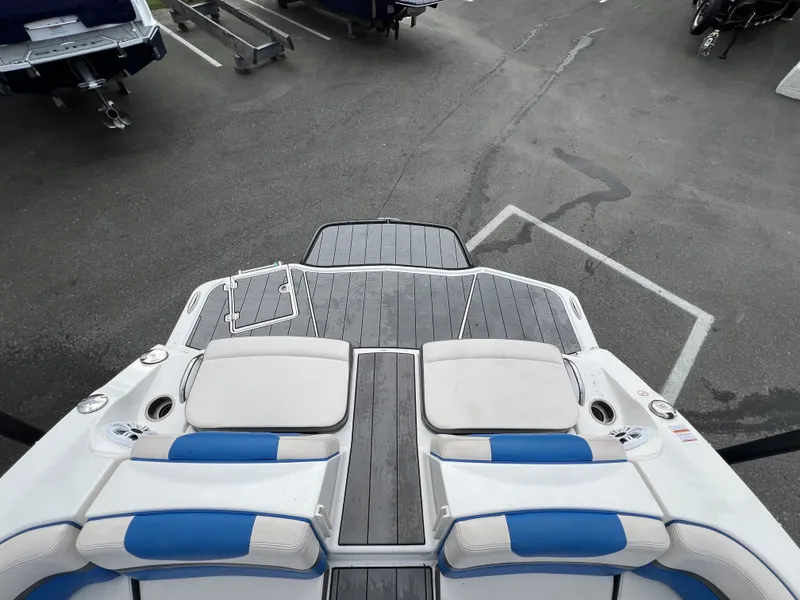 Slide: The Image of Rear view of a 2017 Chaparral Vortex 2430 VRX boat in a parking lot. - 10