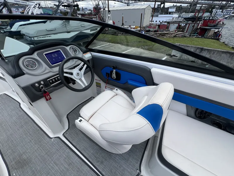 Slide: The Image of Interior of a 2017 Chaparral Vortex 2430 VRX boat, helm view. - 11