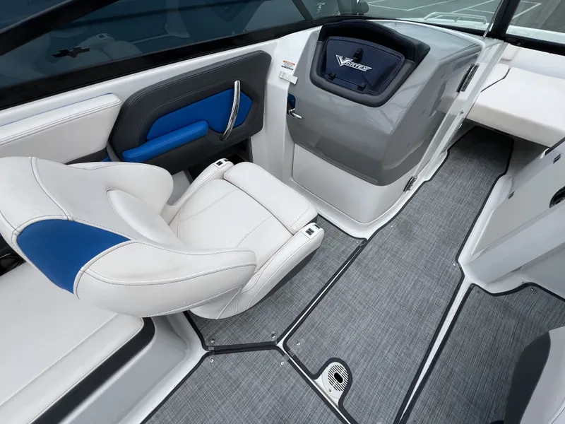 Slide: The Image of Interior of a 2017 Chaparral Vortex 2430 VRX boat with blue accents. - 13