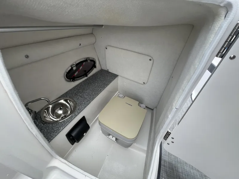 Slide: The Image of Interior of 2017 Chaparral Vortex 2430 VRX with sink and toilet. - 14