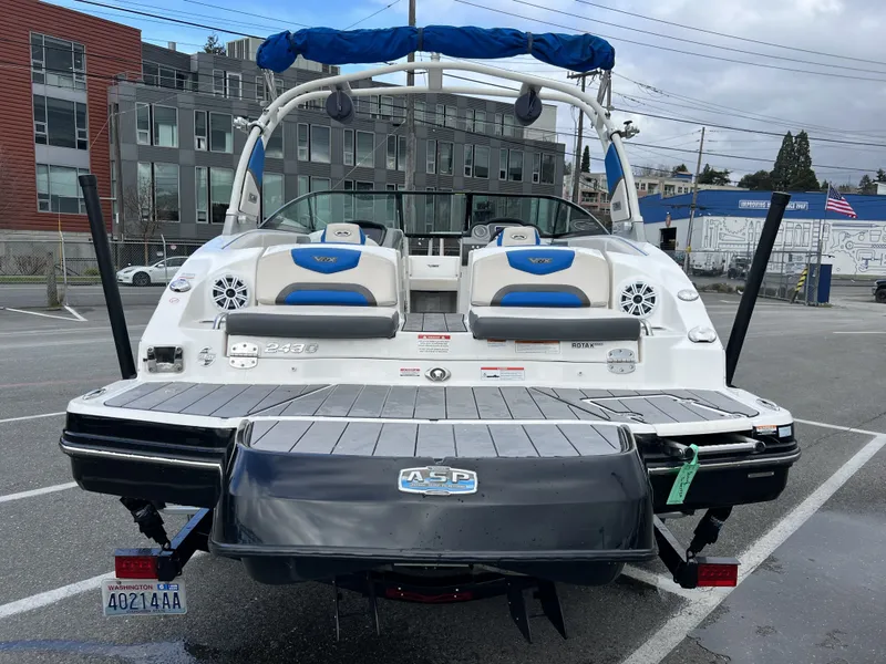 Slide: The Image of Rear view of a 2017 Chaparral Vortex 2430 VRX boat in a parking lot. - 4