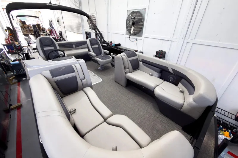 Slide: The Image of 2025 Barletta Cabrio 22UC pontoon boat interior with luxurious seating and modern design. - 11