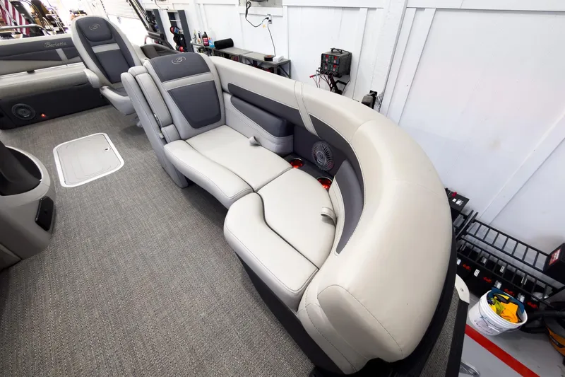 Slide: The Image of 2025 Barletta Cabrio 22UC boat interior with plush seating and modern design. - 12