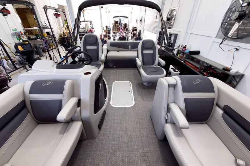 Slide: The Image of 2025 Barletta Cabrio 22UC pontoon boat interior with luxurious seating and modern design. - 13