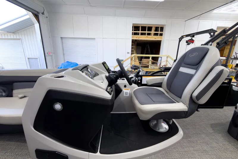 Slide: The Image of 2025 Barletta Cabrio 22UC boat interior with modern helm and comfortable captain's chair. - 14