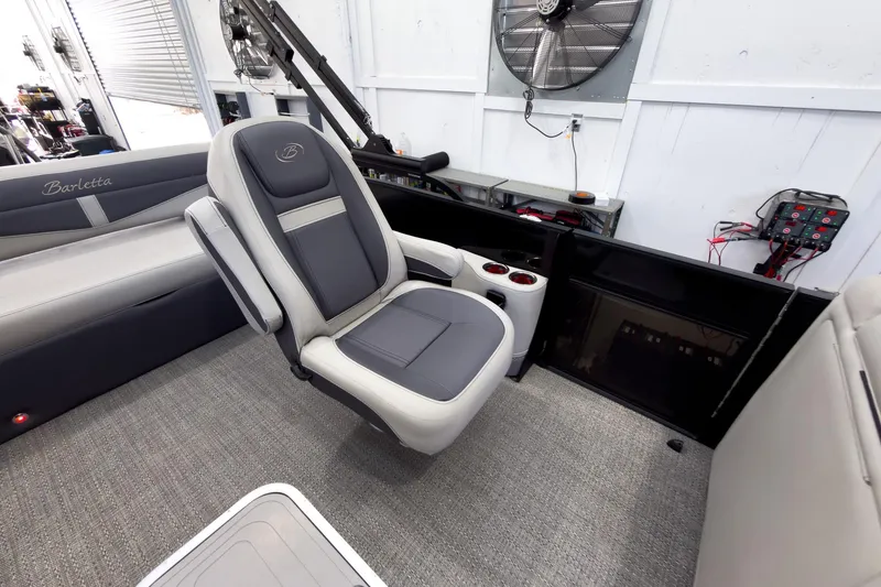 Slide: The Image of 2025 Barletta Cabrio 22UC boat interior with gray seating and modern design. - 18