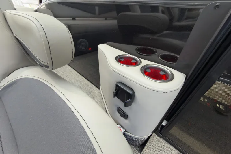 Slide: The Image of Interior of 2025 Barletta Cabrio 22UC with cup holders and seating detail. - 19