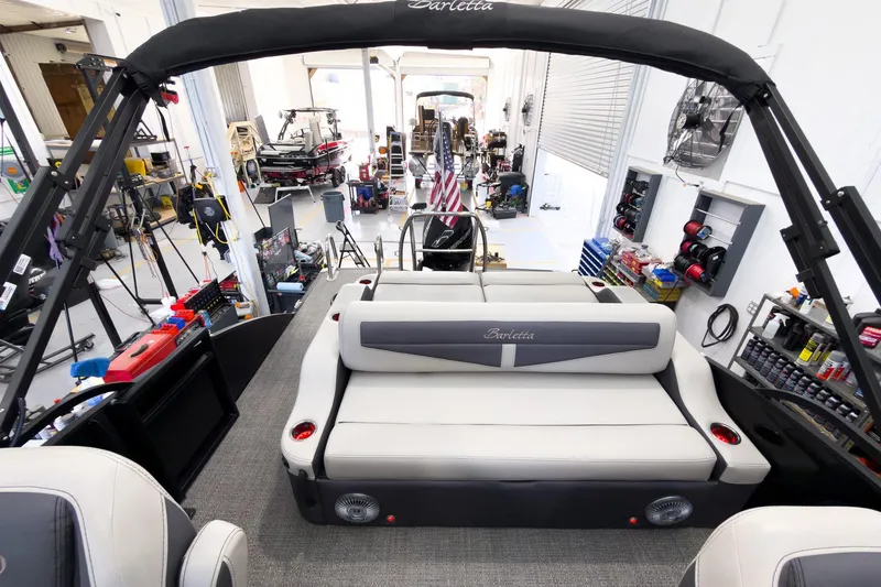 Slide: The Image of 2025 Barletta Cabrio 22UC pontoon boat interior in a workshop setting. - 23