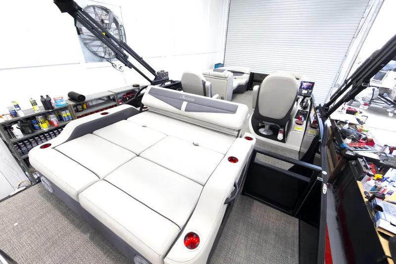 Slide: The Image of 2025 Barletta Cabrio 22UC pontoon boat interior with plush seating and modern controls. - 25