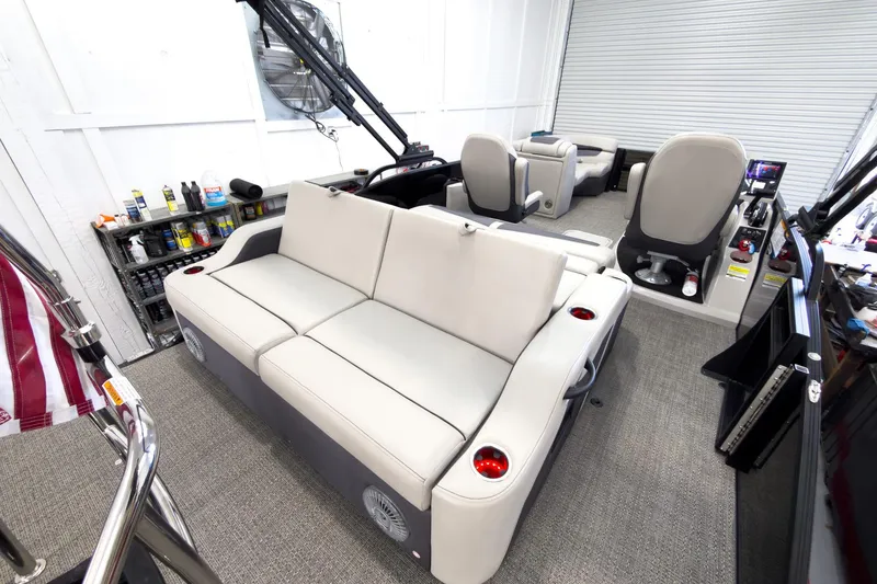 Slide: The Image of 2025 Barletta Cabrio 22UC boat interior with plush seating and modern controls. - 27