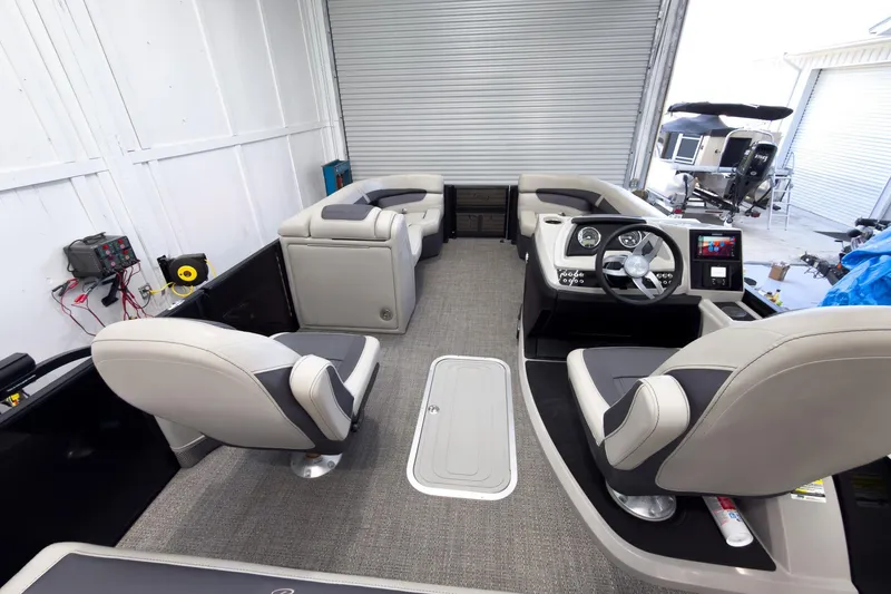 Slide: The Image of 2025 Barletta Cabrio 22UC pontoon boat interior with modern seating and control panel. - 30