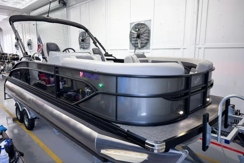 Slide: The Image of 2025 Barletta Cabrio 22UC pontoon boat in a workshop setting. - 32