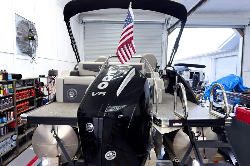 Slide: The Image of 2025 Barletta Cabrio 22UC pontoon boat with V6 engine in a garage setting. - 4