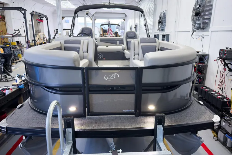 Slide: The Image of 2025 Barletta Cabrio 22UC pontoon boat in a workshop setting. - 7