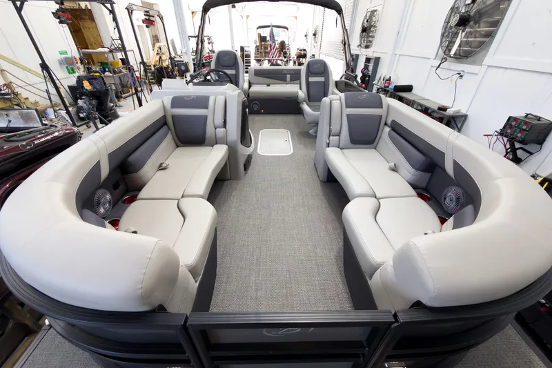 Slide: The Image of 2025 Barletta Cabrio 22UC pontoon boat interior with luxurious seating and modern design. - 8