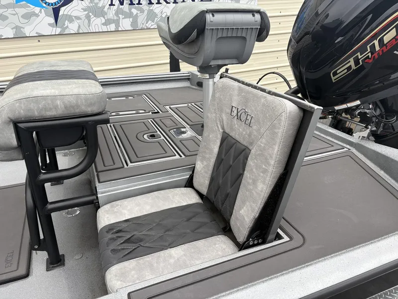 Slide: The Image of 2026 Excel 230 Bay Pro boat seat and motor view. - 4