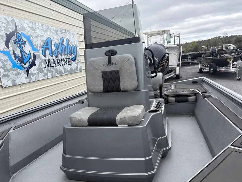 Slide: The Image of Excel 230 Bay Pro 2026 at Ashley Marine, gray interior, outdoor view. - 6