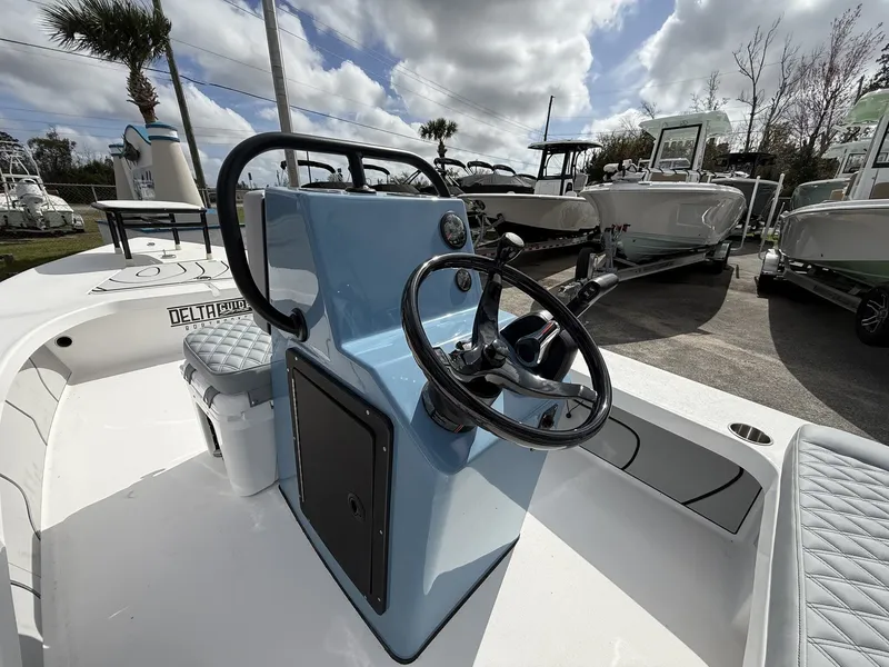 Slide: The Image of Delta Boatworks D18 CC Guide Series 2026 with blue helm station. - 8