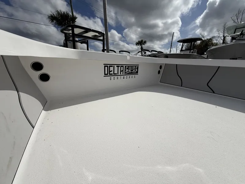 Slide: The Image of Delta Boatworks D18 CC Guide Series 2026 under cloudy sky. - 9