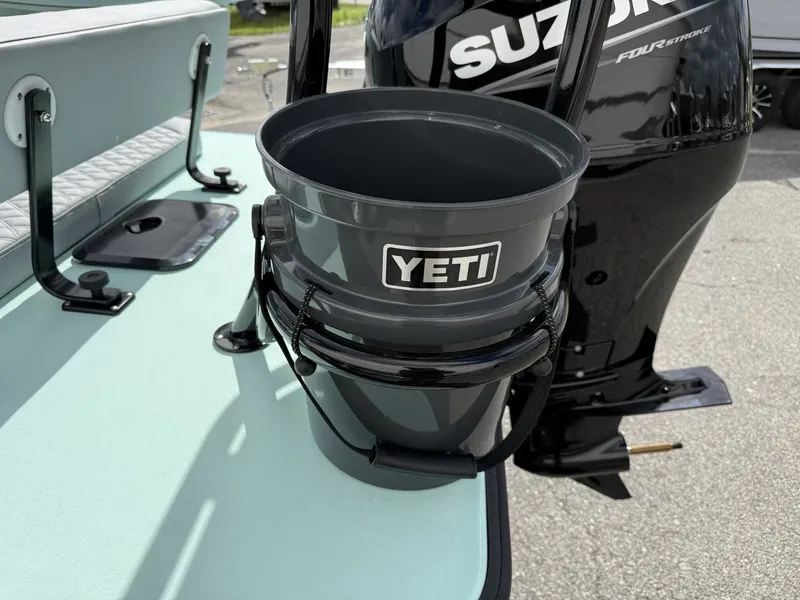Slide: The Image of Delta Boatworks D18 CC with Yeti bucket and Suzuki motor, 2026 model. - 4