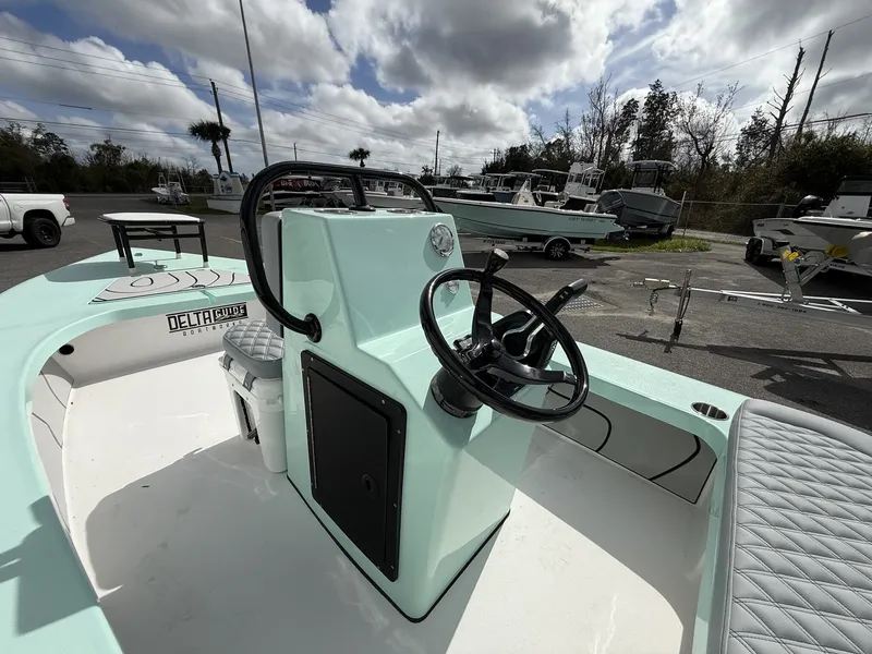 Slide: The Image of Delta Boatworks D18 CC Guide Series 2026 displayed outdoors. - 9