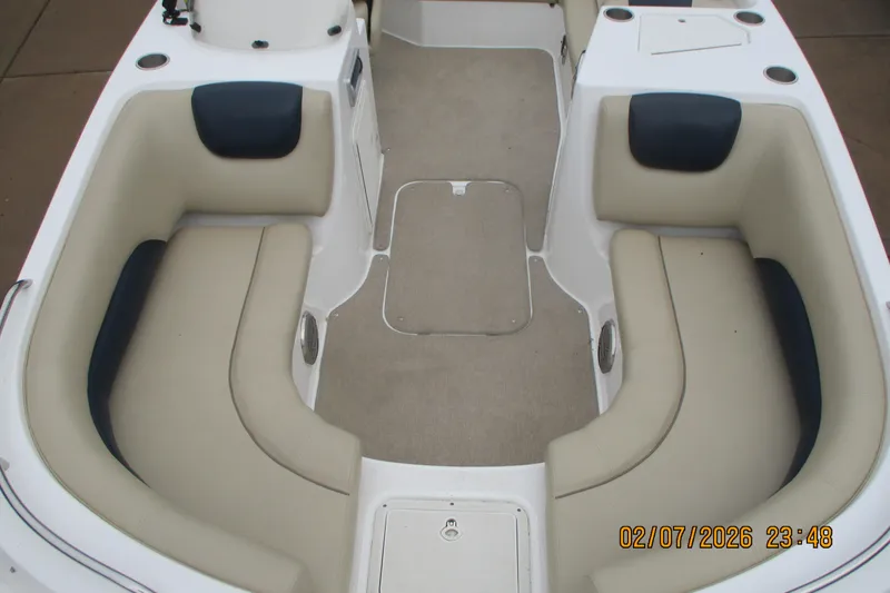 Slide: The Image of 2016 Hurricane FunDeck GS 188 IO boat interior with beige seating and carpeted floor. - 8