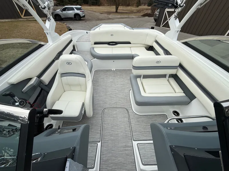 Slide: The Image of Interior of 2022 Cobalt CS23 Surf with luxurious white seating. - 34