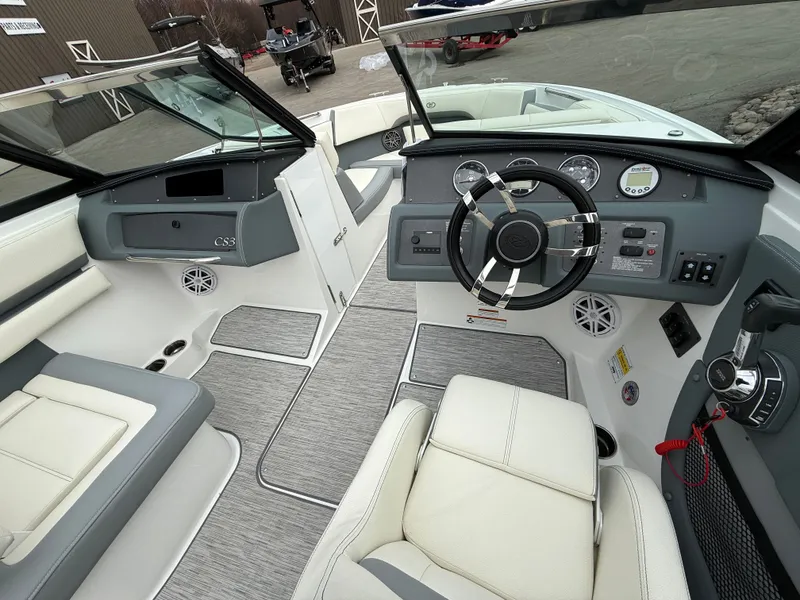 Slide: The Image of Interior of 2022 Cobalt CS23 Surf boat with steering console. - 43