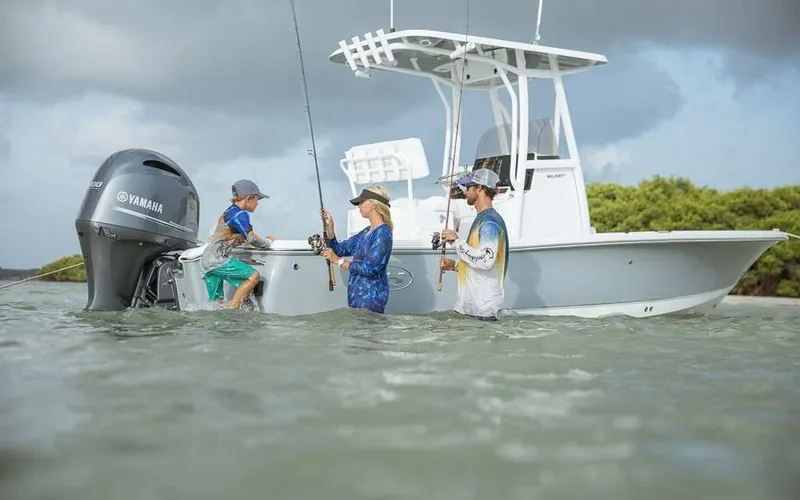 Slide: The Image of Family fishing beside Sea Hunt BX 22 BR boat, 2026 model. - 9