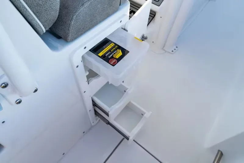 Slide: The Image of 2026 Sea Hunt Ultra 275 CB boat with storage compartments and drawers. - 13