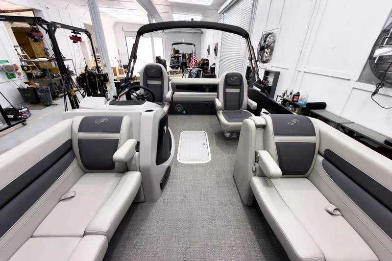 Slide: The Image of 2025 Barletta Cabrio 24UC pontoon boat interior with luxurious seating and modern design. - 12