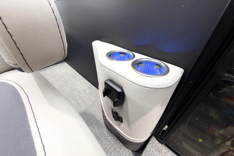 Slide: The Image of 2025 Barletta Cabrio 24UC interior with illuminated cup holders and sleek upholstery. - 20