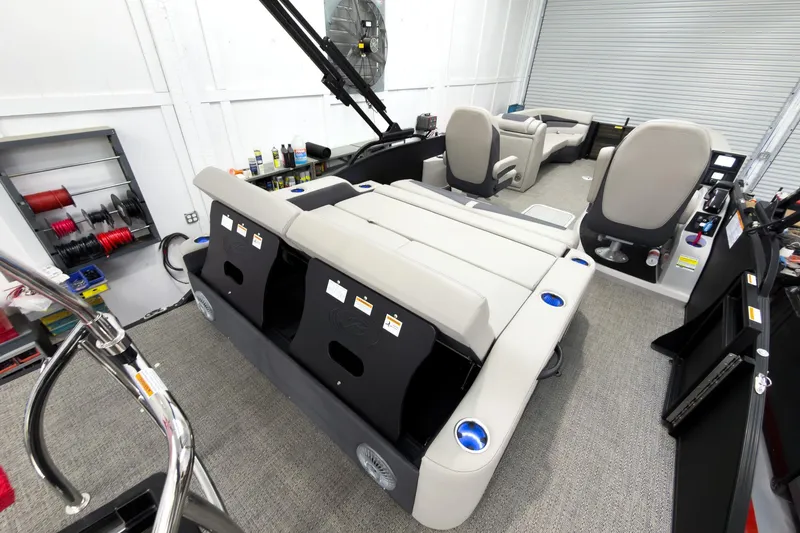 Slide: The Image of 2025 Barletta Cabrio 24UC pontoon boat interior with plush seating and modern amenities. - 27