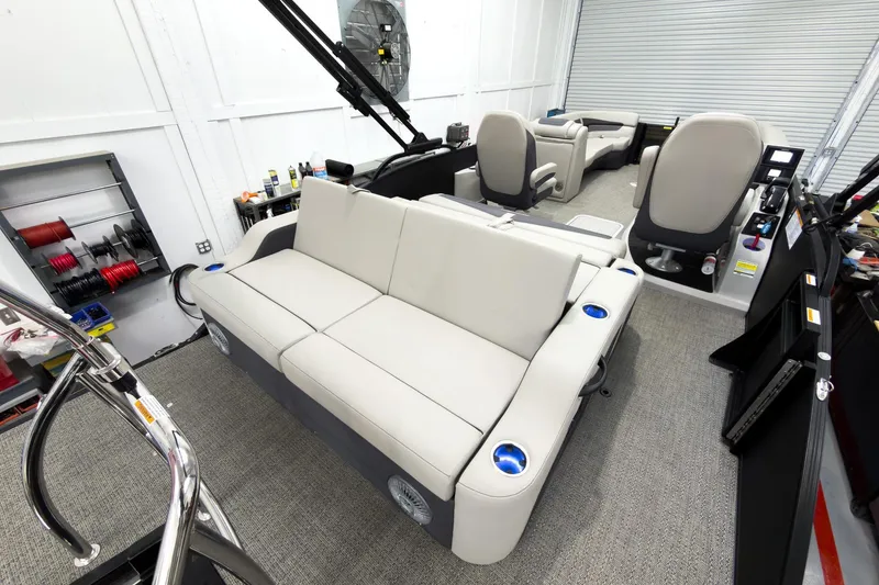 Slide: The Image of 2025 Barletta Cabrio 24UC pontoon boat interior with plush seating and modern amenities. - 29