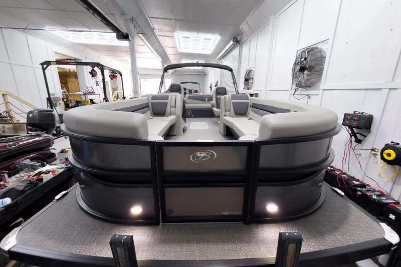 Slide: The Image of 2025 Barletta Cabrio 24UC pontoon boat in a workshop setting. - 7