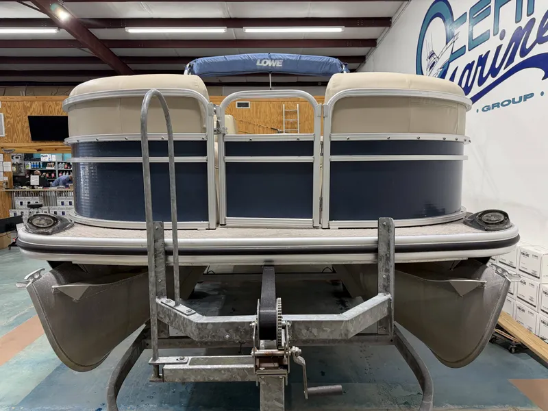 Slide: The Image of 2014 Lowe SS 210 pontoon boat in a workshop. - 23